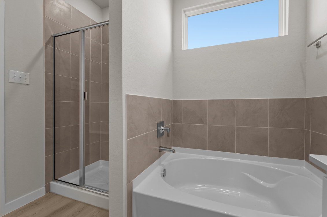 A bathroom with a glass shower.