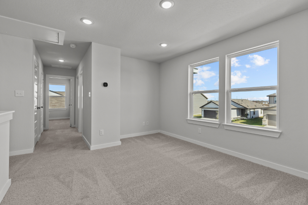 A room with a window and a door.