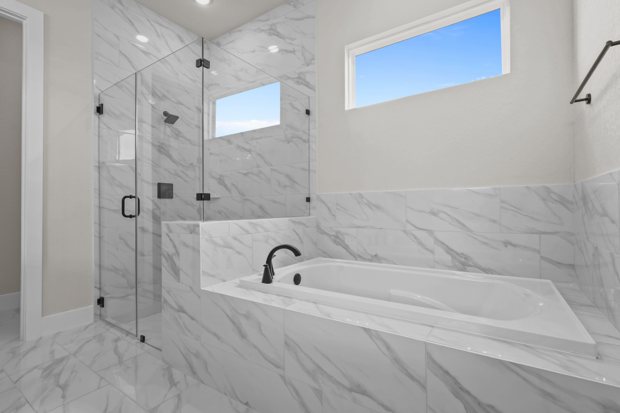 A bathroom with a glass shower.