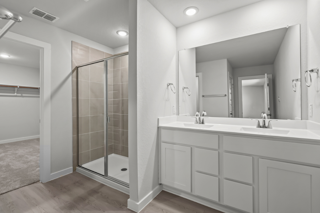 A bathroom with a glass shower.