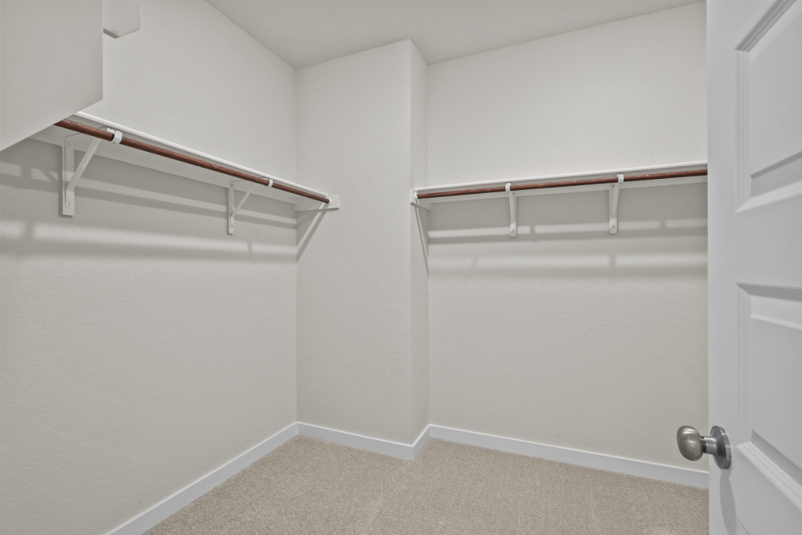 A white room with a white door.