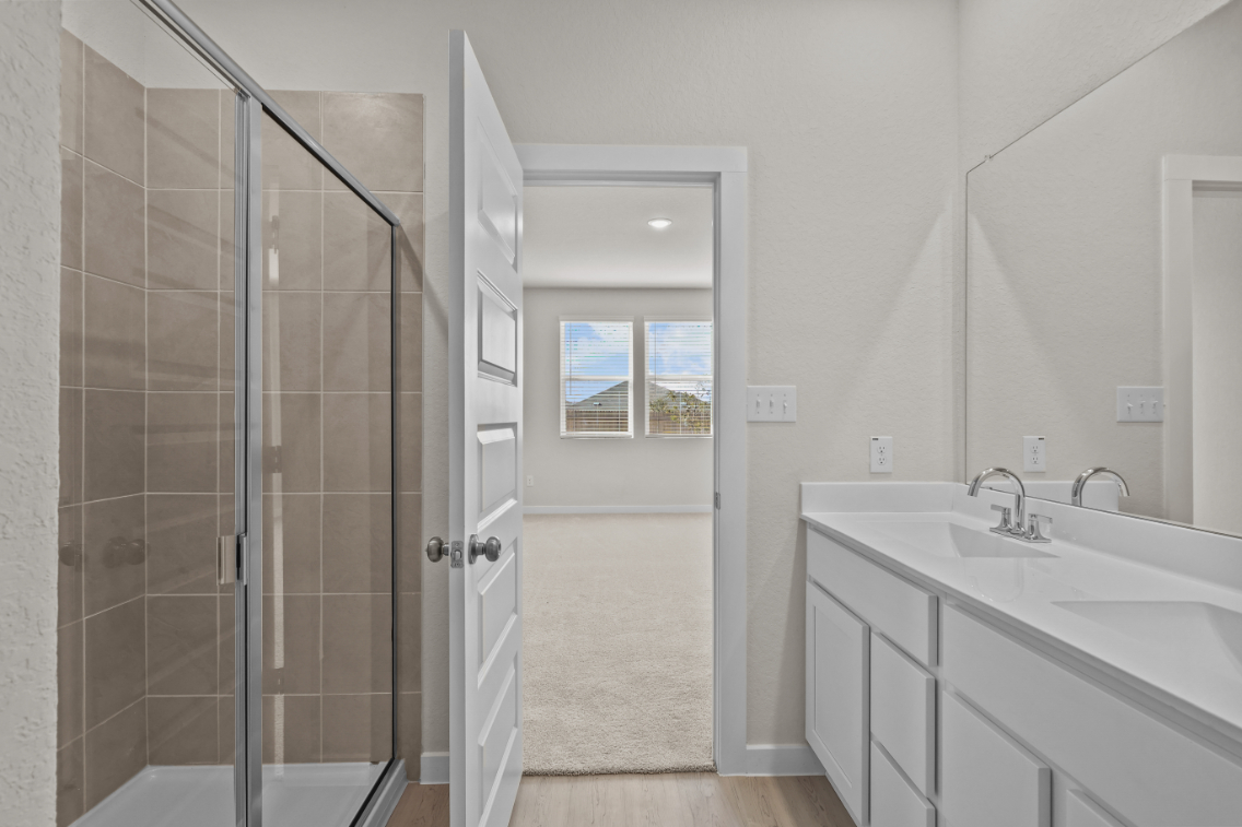 A bathroom with a glass shower.