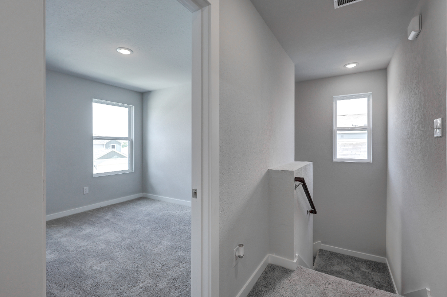 A room with a door and windows.