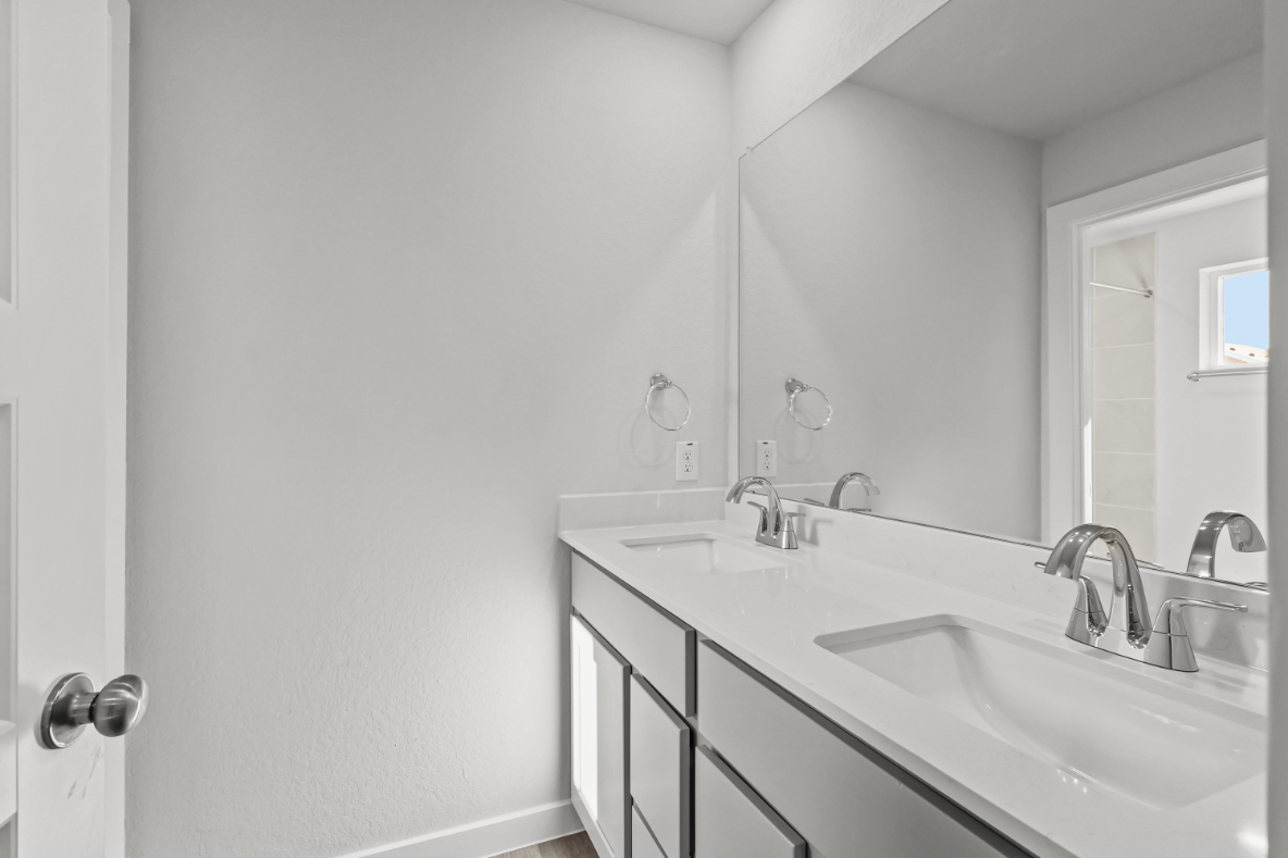 A bathroom with two sinks.