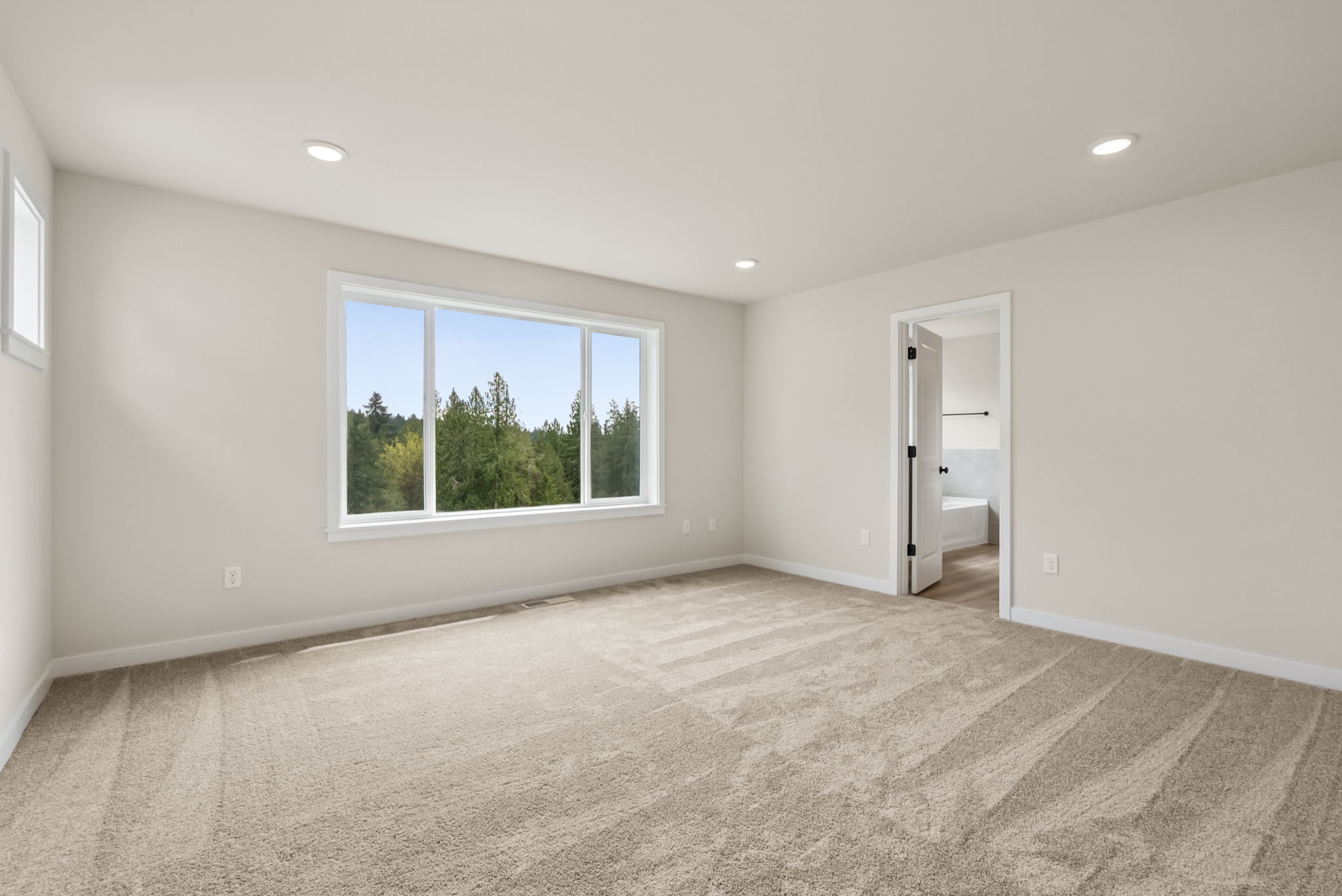 A room with a window and a door.