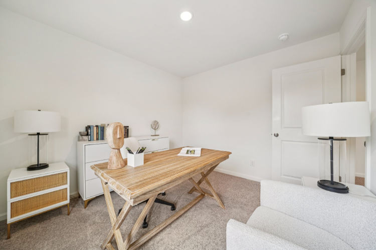 A room with a table and lamps.