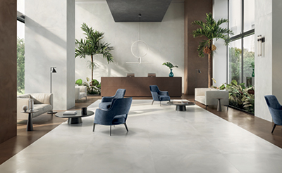 A room with a large glass door and a large white floor.